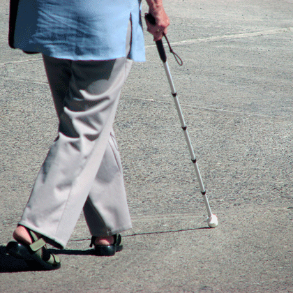woman walking with white cane