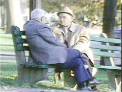men on visiting bench